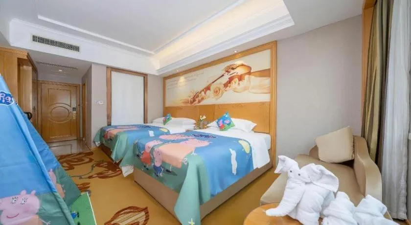 Bed in Vienna Hotel Guangxi Fangcheng