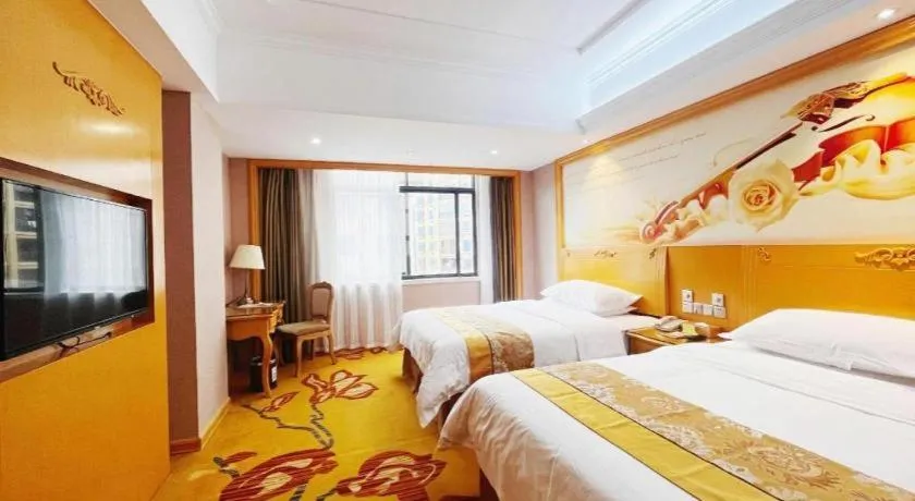 Bed in Vienna Hotel Guangxi Fangcheng