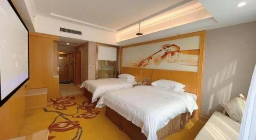 Bed in Vienna Hotel Guangxi Fangcheng