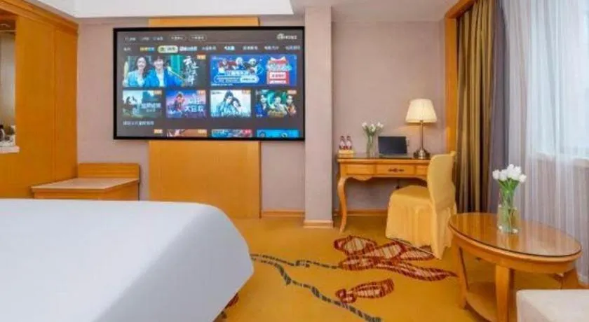 Bed in Vienna Hotel Guangxi Fangcheng