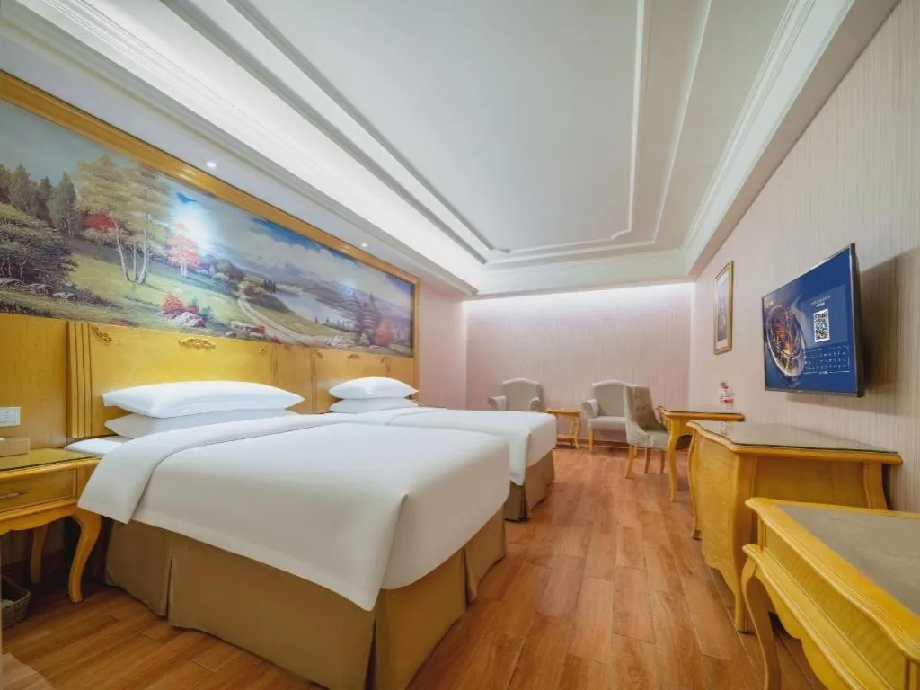 Bed in Vienna Hotel Shenzhen Pingdi Huancheng South Road
