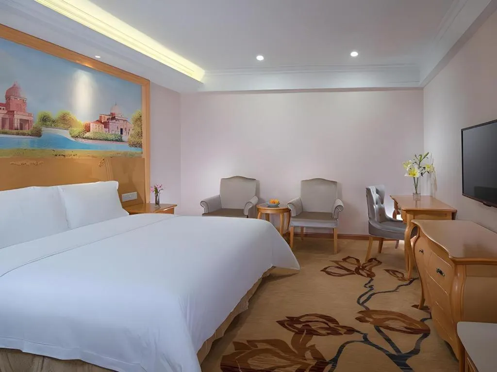 Bed in Vienna Hotel Shenzhen Pingdi Huancheng South Road