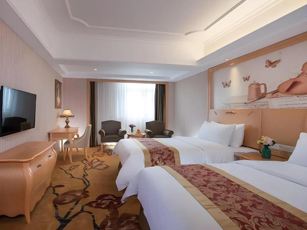 Bed in Vienna Hotel Shenzhen Pingdi Huancheng South Road