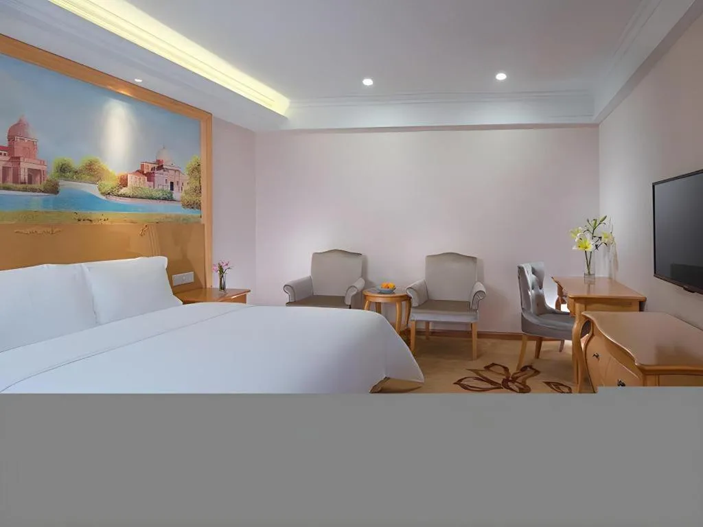 Bed in Vienna Hotel Shenzhen Pingdi Huancheng South Road