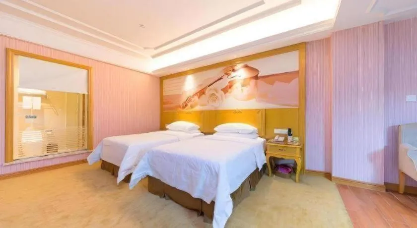Bed in Vienna Hotel Shenzhen Pingdi Huancheng South Road
