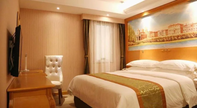 Bed in Vienna Hotel Shandong Laizhou Langhu International Plaza