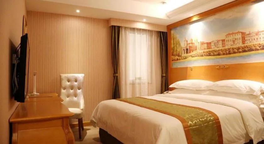 Bed in Vienna Hotel Shandong Laizhou Langhu International Plaza