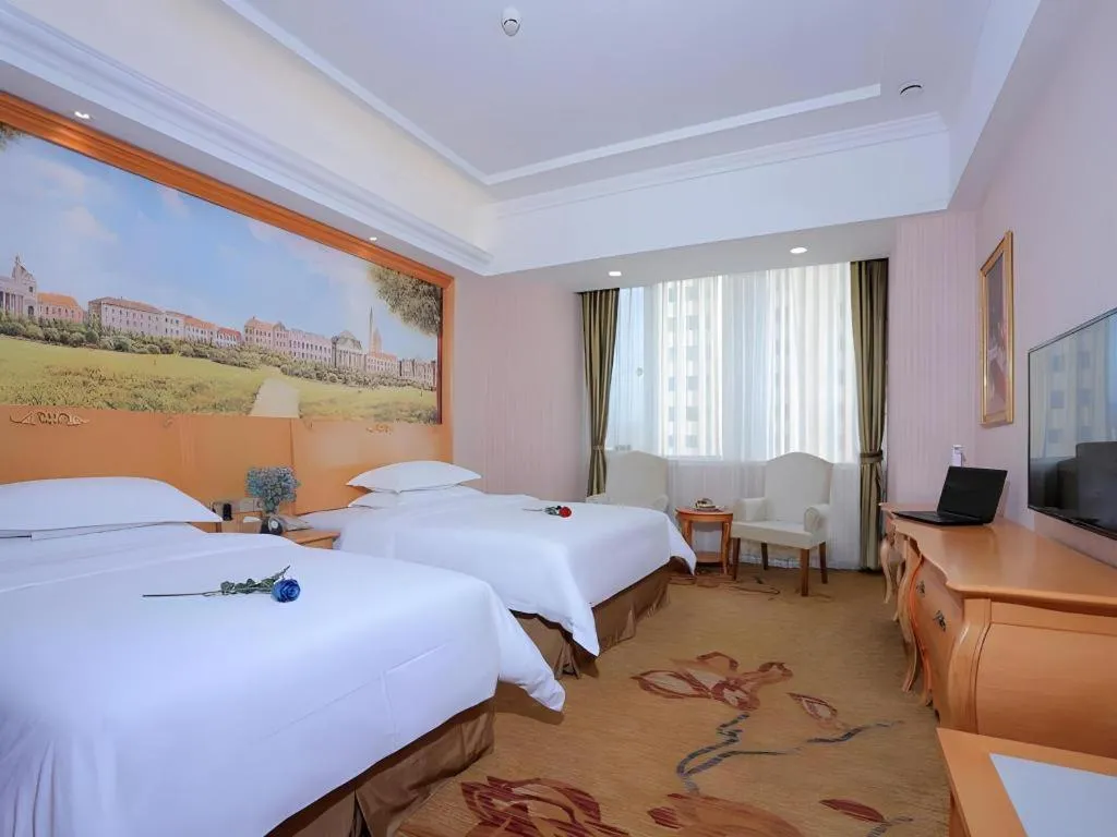 Bed in Vienna Hotel Shandong Laizhou Langhu International Plaza