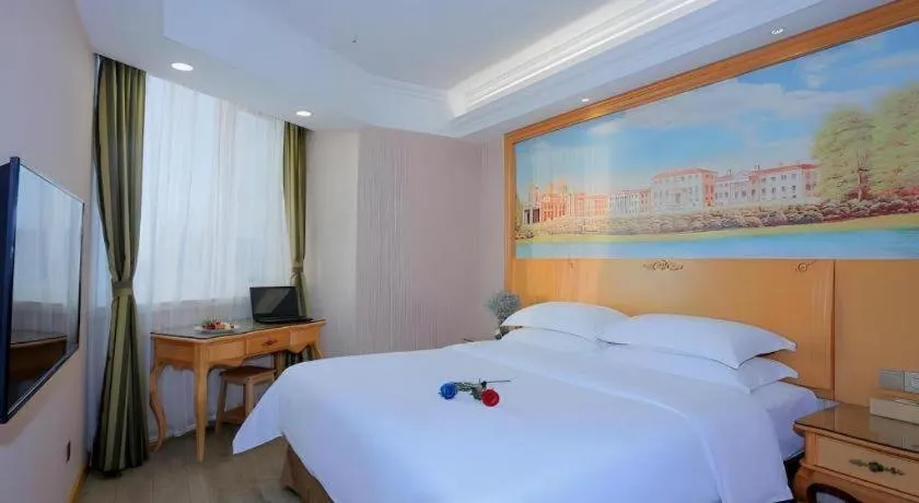 Bed in Vienna Hotel Shandong Laizhou Langhu International Plaza