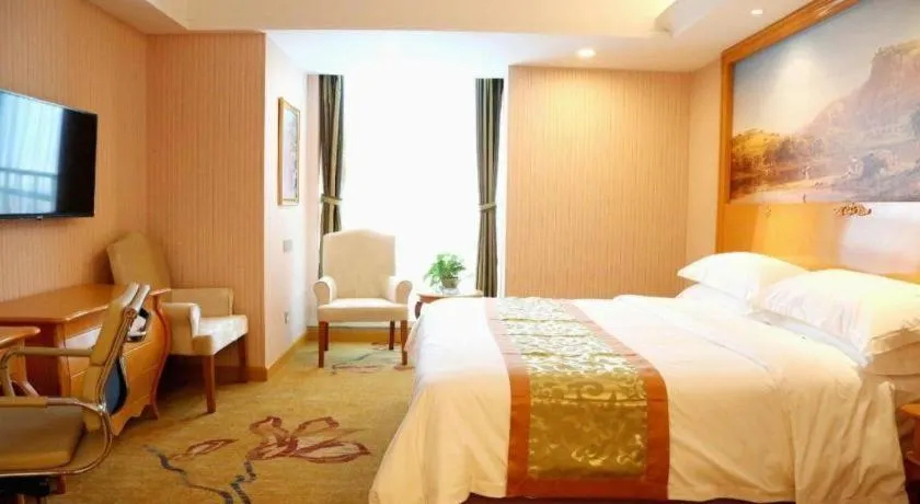 Bed in Vienna Hotel Shandong Laizhou Langhu International Plaza