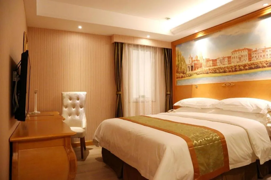 Bed in Vienna Hotel Shandong Laizhou Langhu International Plaza