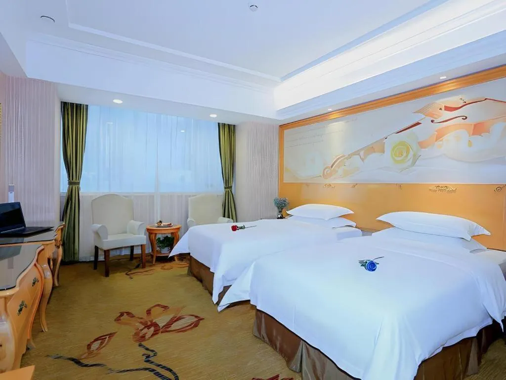 Bed in Vienna Hotel Shandong Laizhou Langhu International Plaza