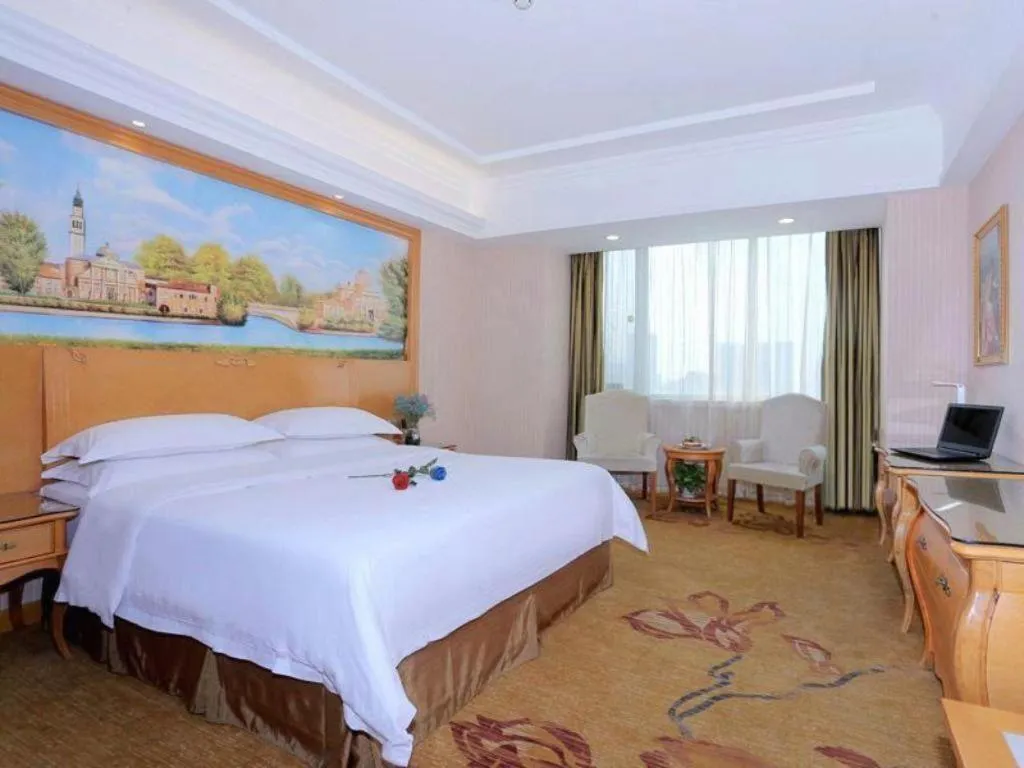 Bed in Vienna Hotel Shandong Laizhou Langhu International Plaza