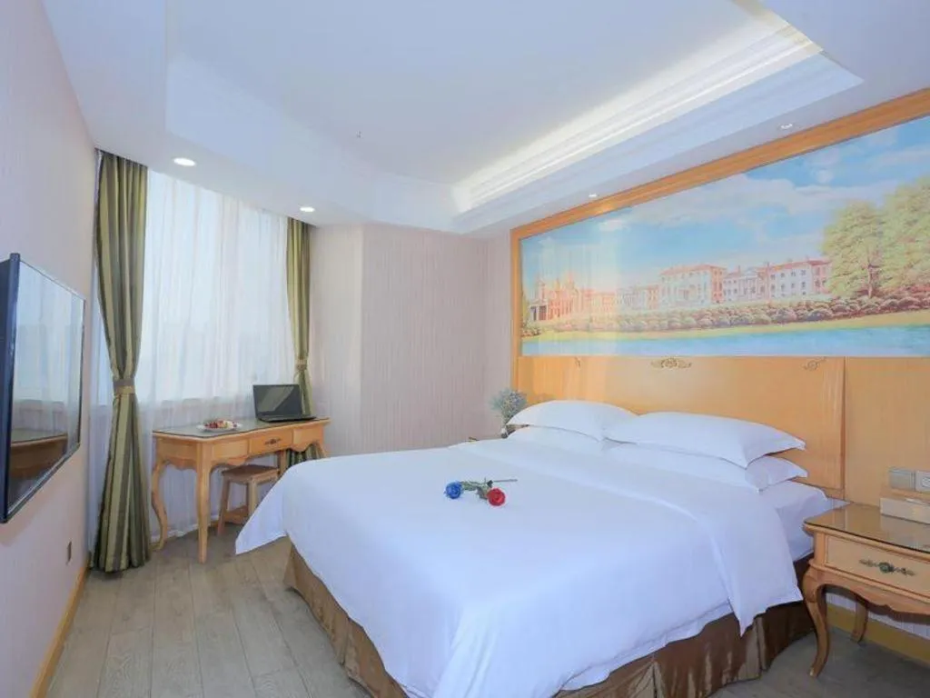Bed in Vienna Hotel Shandong Laizhou Langhu International Plaza