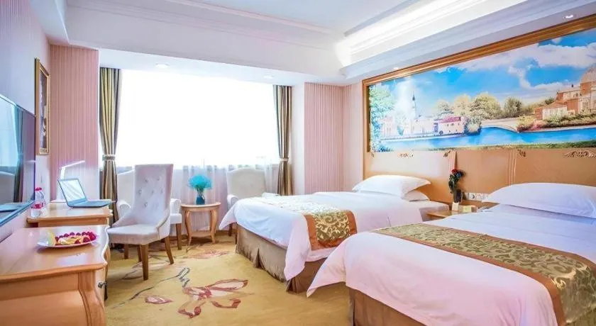 Bed in Vienna Hotel Shandong Laizhou Langhu International Plaza