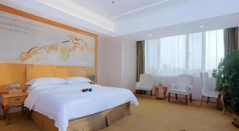 Bed in Vienna Hotel Shandong Laizhou Langhu International Plaza