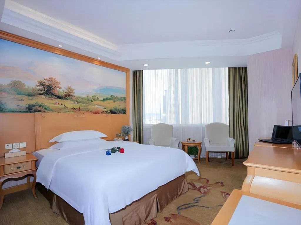 Bed in Vienna Hotel Shandong Laizhou Langhu International Plaza