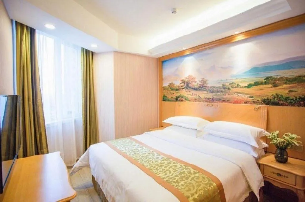 Bed in Vienna Hotel Shandong Laizhou Langhu International Plaza