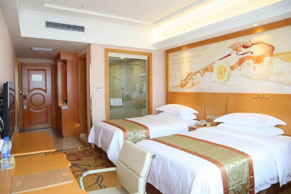 Bed in Vienna Hotel Shandong Laizhou Langhu International Plaza
