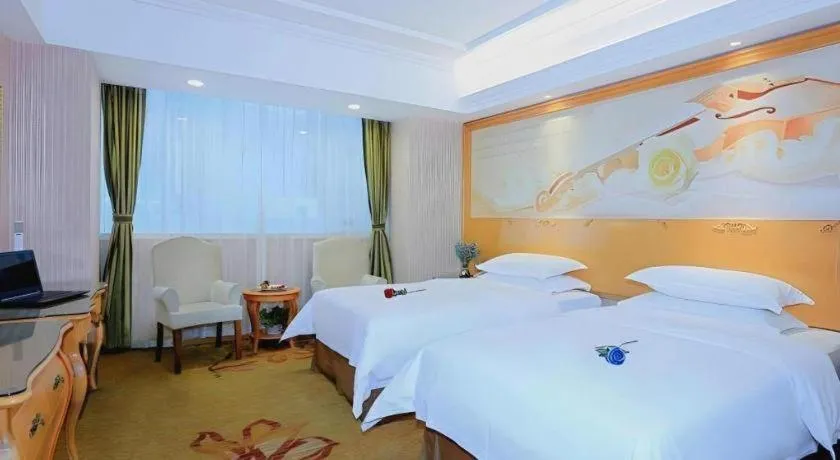 Bed in Vienna Hotel Shandong Laizhou Langhu International Plaza