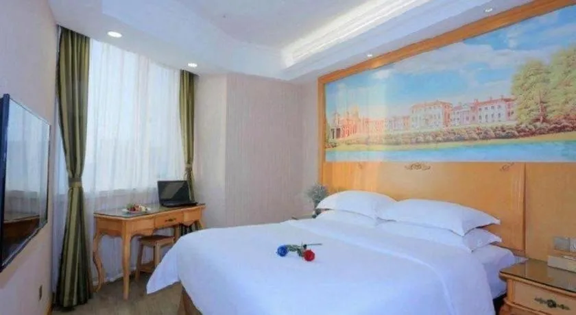 Bed in Vienna Hotel Shandong Laizhou Langhu International Plaza