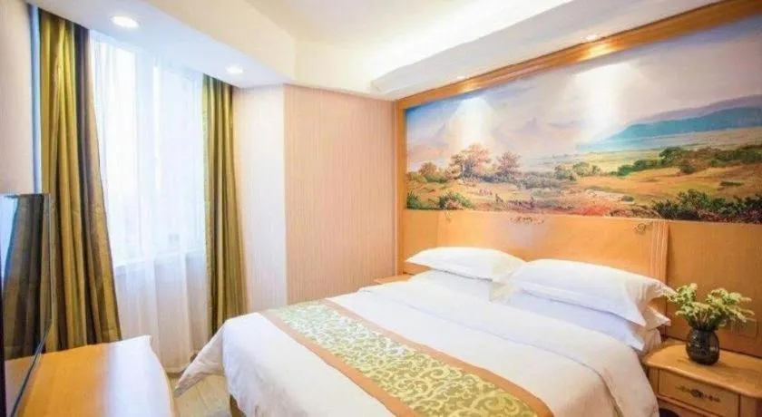 Bed in Vienna Hotel Shandong Laizhou Langhu International Plaza