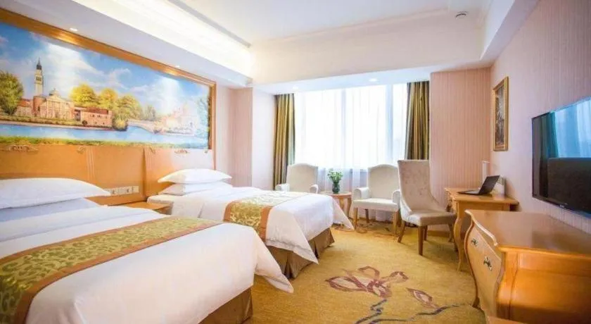 Bed in Vienna Hotel Shandong Laizhou Langhu International Plaza