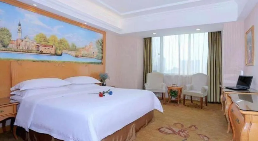 Bed in Vienna Hotel Shandong Laizhou Langhu International Plaza