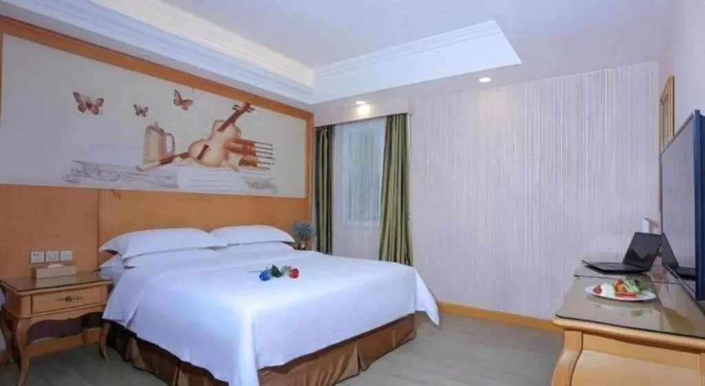 Bed in Vienna Hotel Shandong Laizhou Langhu International Plaza