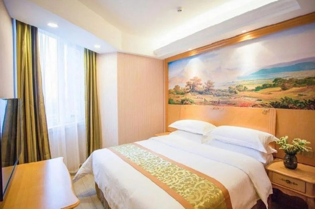 Bed in Vienna Hotel Shandong Laizhou Langhu International Plaza