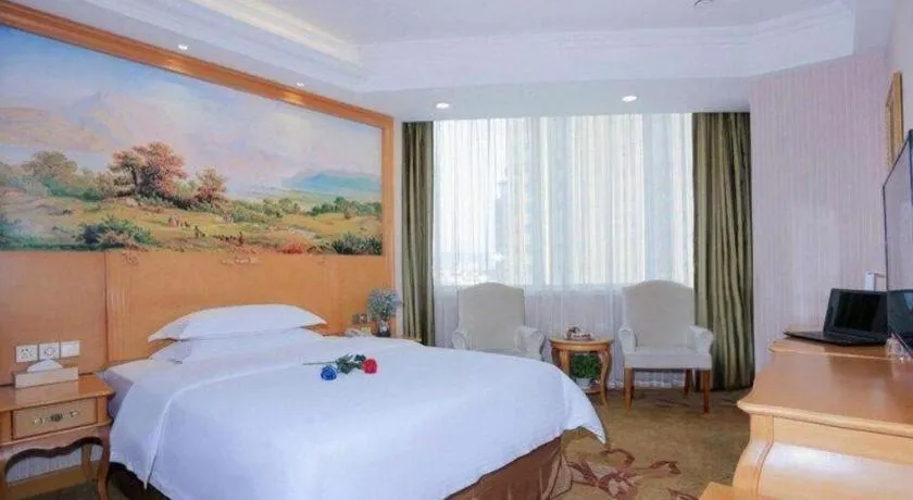 Bed in Vienna Hotel Shandong Laizhou Langhu International Plaza