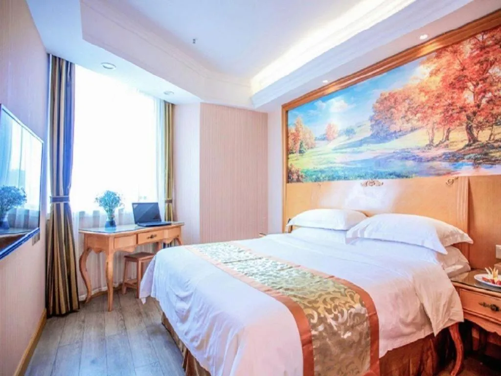 Bed in Vienna Hotel Shandong Laizhou Langhu International Plaza