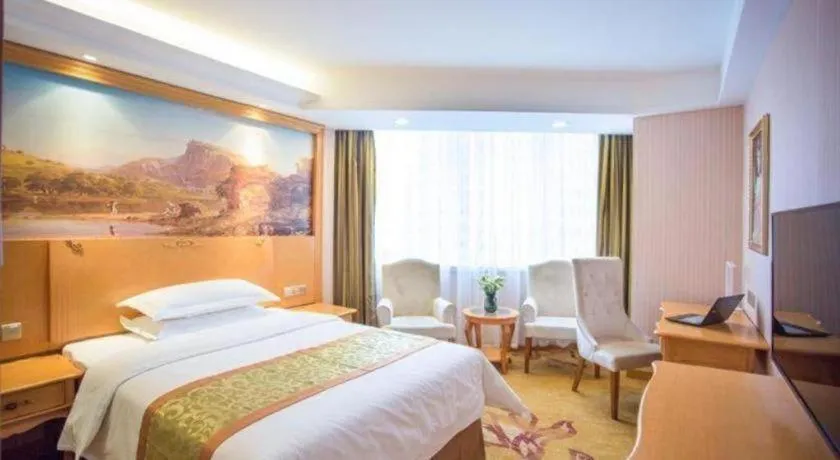 Bed in Vienna Hotel Shandong Laizhou Langhu International Plaza