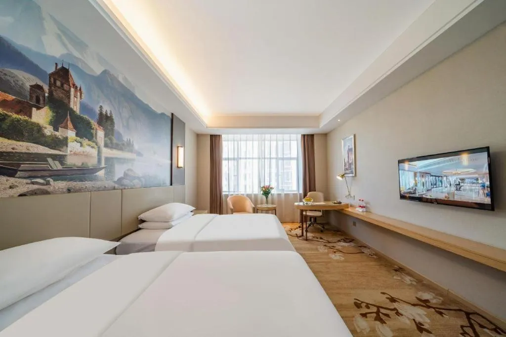 Bed in Vienna Hotel Guangdong Shaoguan Shaonan Avenue