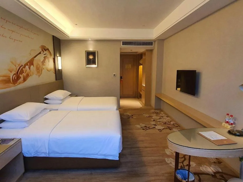 Bed in Vienna Hotel Guangdong Shaoguan Shaonan Avenue