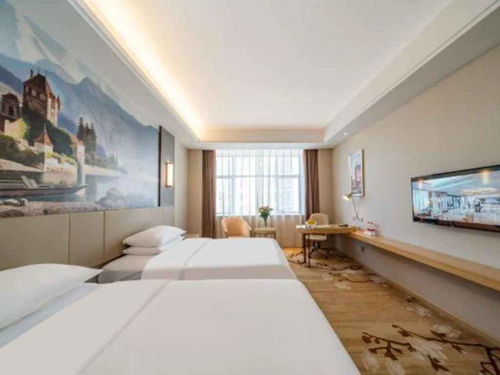 Bed in Vienna Hotel Guangdong Shaoguan Shaonan Avenue