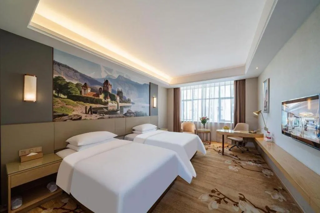 Bed in Vienna Hotel Guangdong Shaoguan Shaonan Avenue