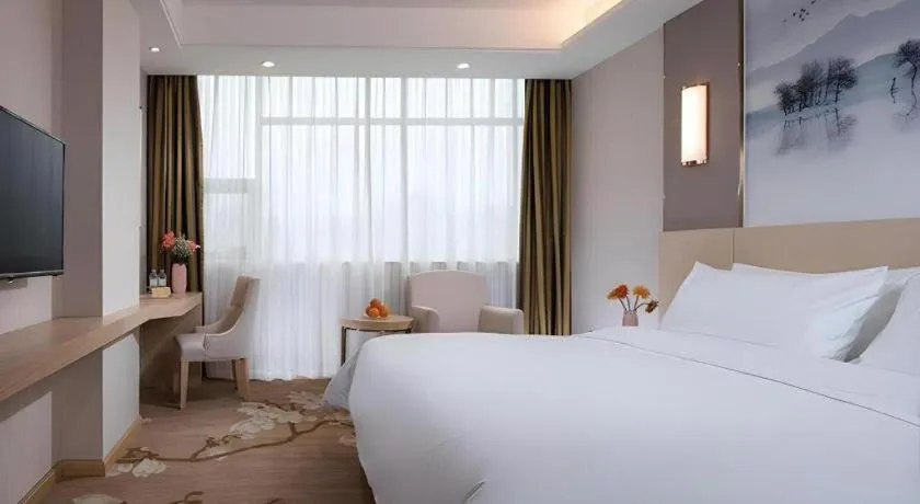 Bed in Vienna Hotel Hunan Huaihua Xupu Wanda Plaza