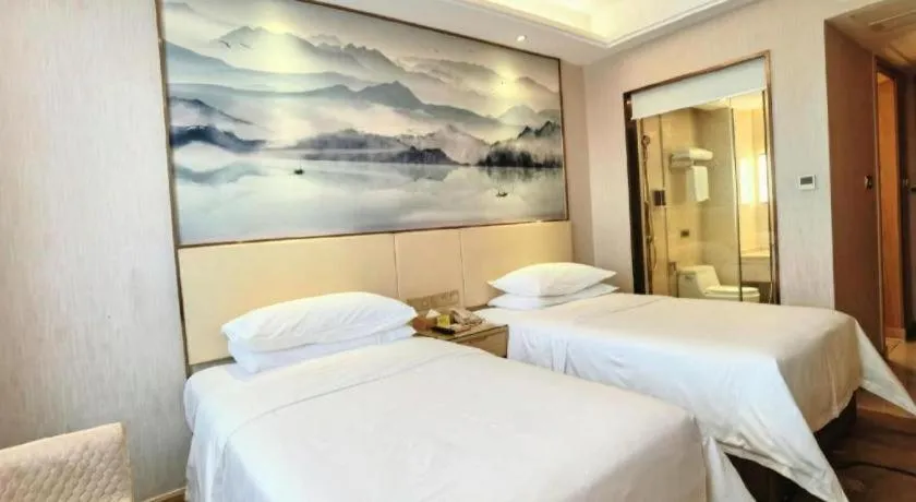 Bed in Vienna Hotel Hunan Huaihua Xupu Wanda Plaza