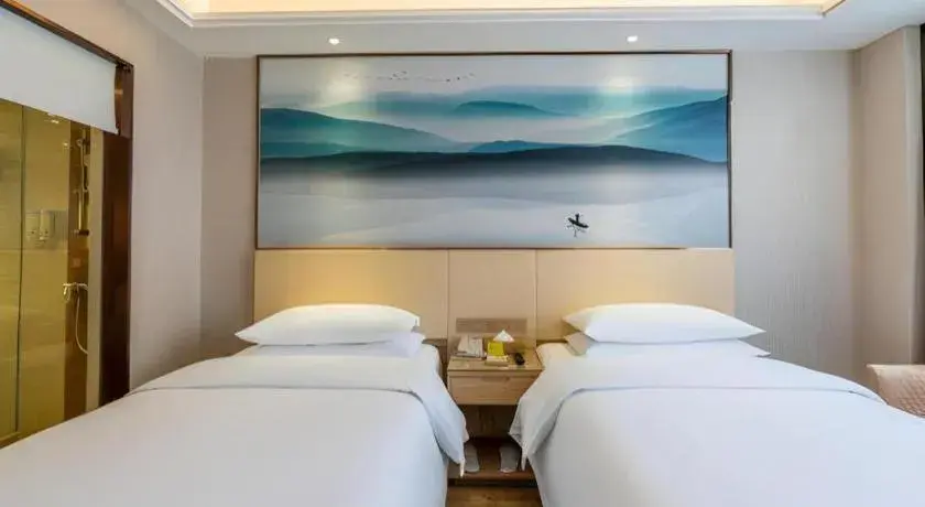Bed in Vienna Hotel Hunan Huaihua Xupu Wanda Plaza Bed in Vienna Hotel Hunan Huaihua Xupu Wanda Plaza