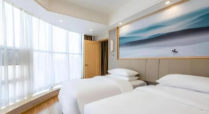 Bed in Vienna Hotel Hunan Huaihua Xupu Wanda Plaza Bed in Vienna Hotel Hunan Huaihua Xupu Wanda Plaza