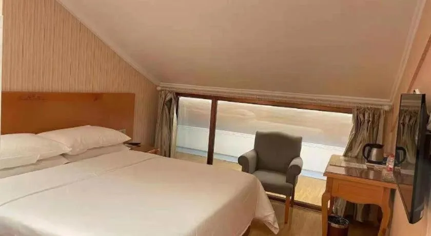 Bed in Vienna Hotel Inner Mongolia Tongliao Development Zone