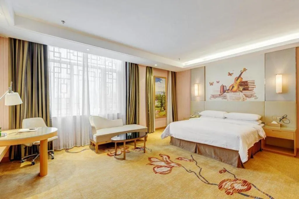 Bed in Vienna Hotel Shandong Qufu Sankong Landscape