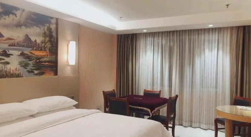 Bed in Vienna Hotel Shandong Qufu Sankong Landscape