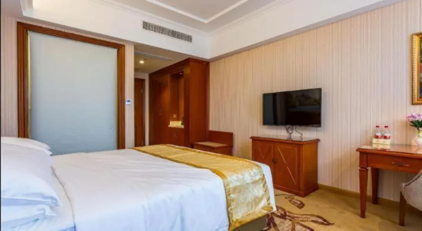 Bed in Vienna Hotel Shandong Qufu Sankong Landscape