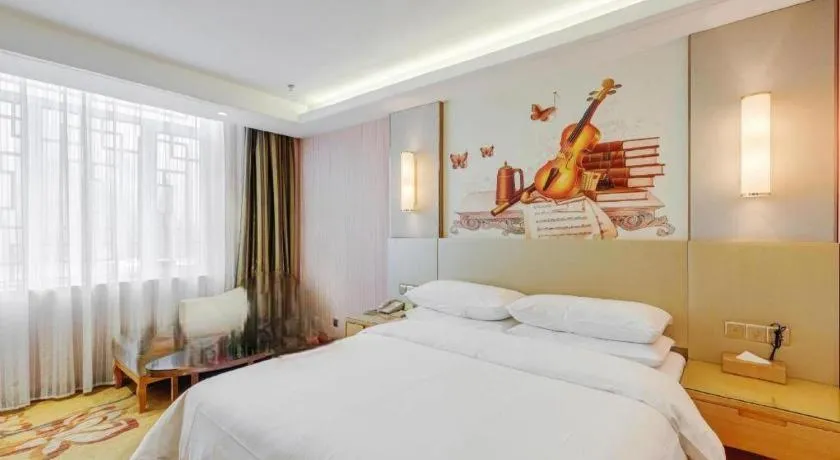 Bed in Vienna Hotel Shandong Qufu Sankong Landscape