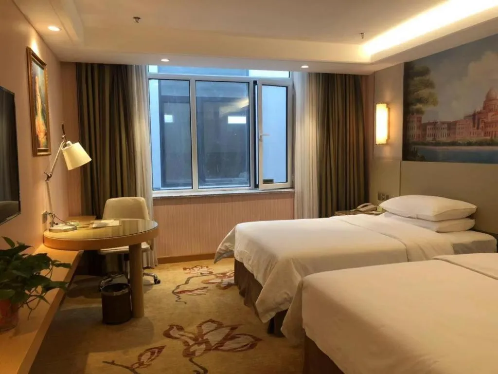 Bed in Vienna Hotel Shandong Qufu Sankong Landscape