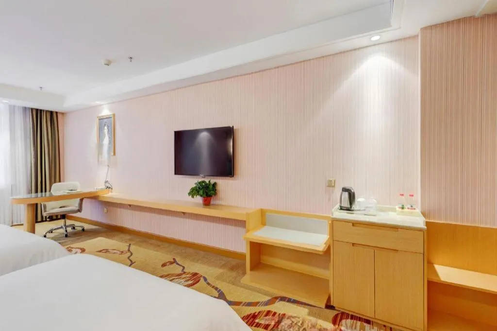 Bed in Vienna Hotel Shandong Qufu Sankong Landscape