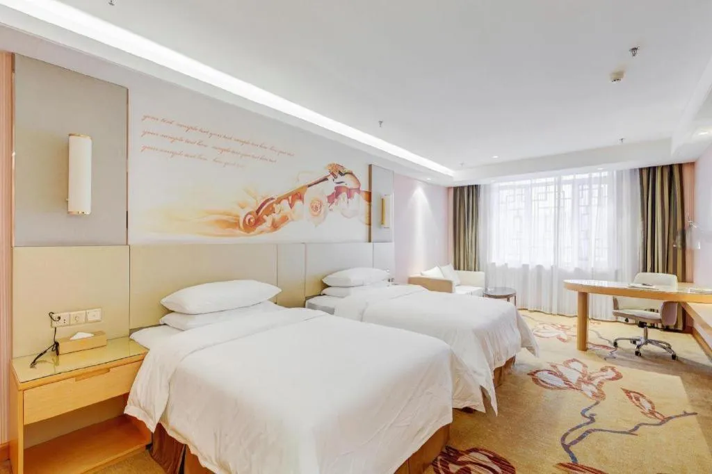 Bed in Vienna Hotel Shandong Qufu Sankong Landscape
