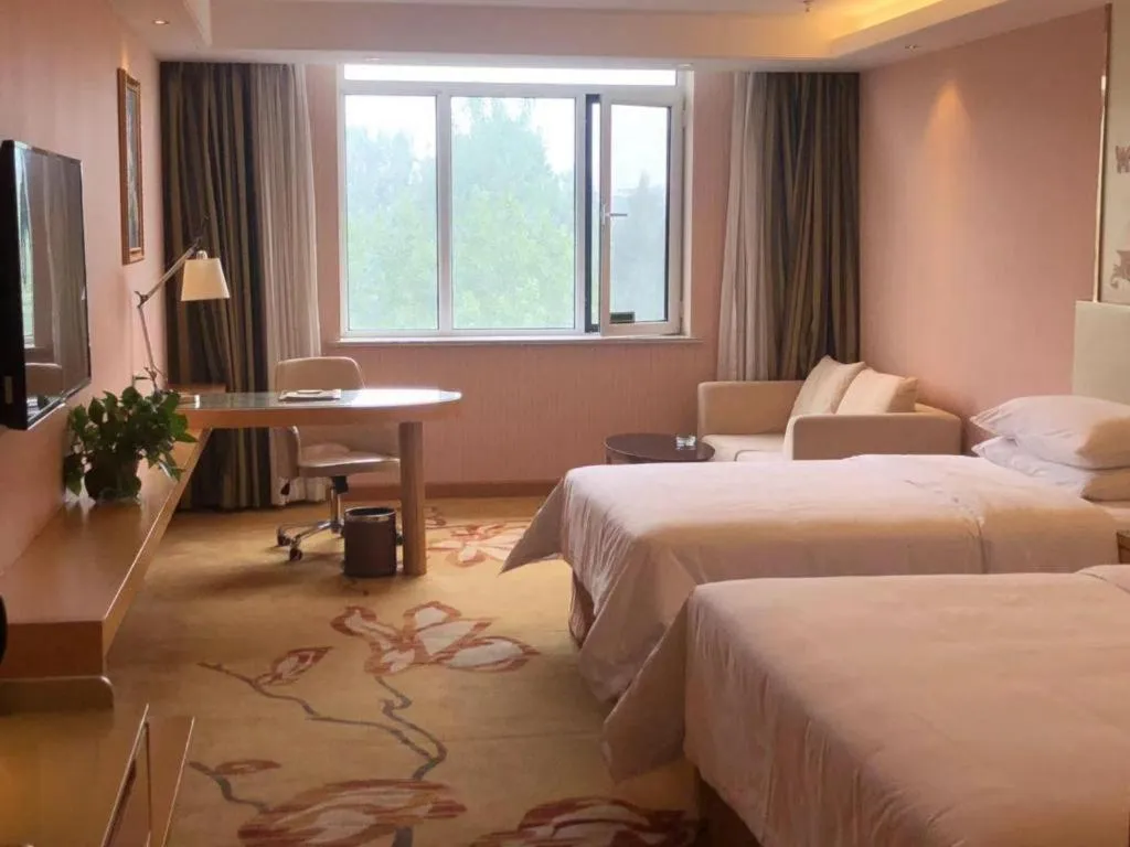 Bed in Vienna Hotel Shandong Qufu Sankong Landscape